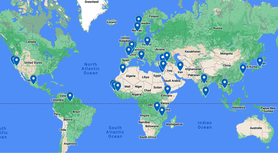 A world map highlighting various locations with blue markers. The markers are spread across multiple continents including North America, South America, Europe, Africa, and Asia. These markers likely indicate significant points of interest, such as offices, events